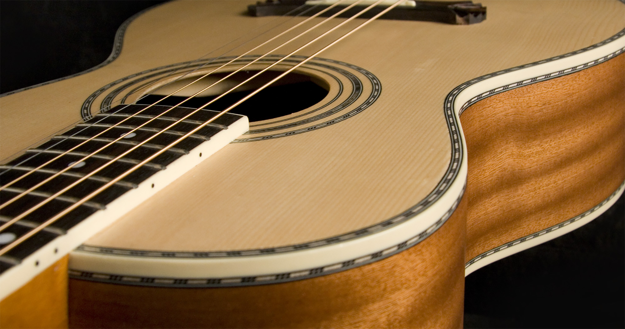 Oscar Schmidt parlor acoustic guitar in a sunburst finish